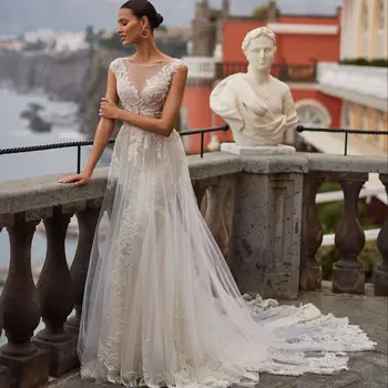 Muhteşem A-Line düğün elbisesi Dantel Aplike Kısa Cap Kollu Parlak Illusion O-Boyun gelin kıyafeti Sweep Tren Vestidos De Novia